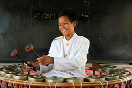 Odom playing Cambodian Gongs